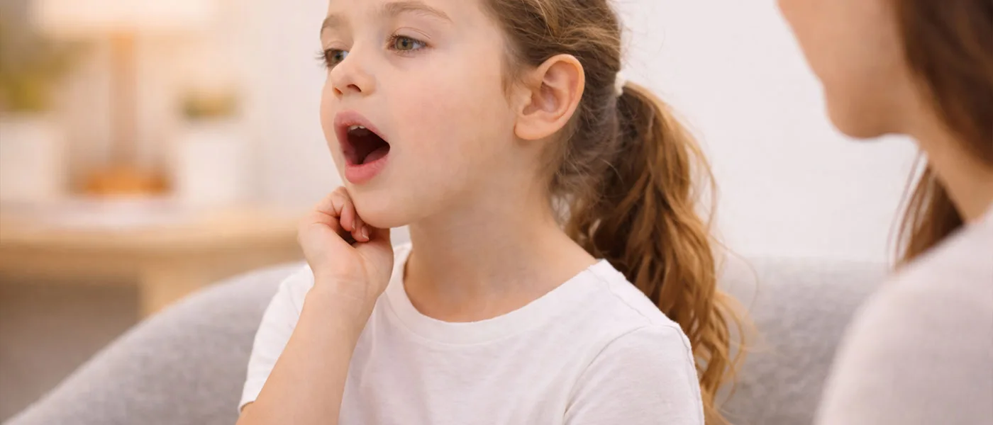 A child smiling, representing healthy development